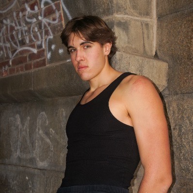 Ben Davis, 6 foot 9 model and creator, photographed against a stone wall in Philadelphia